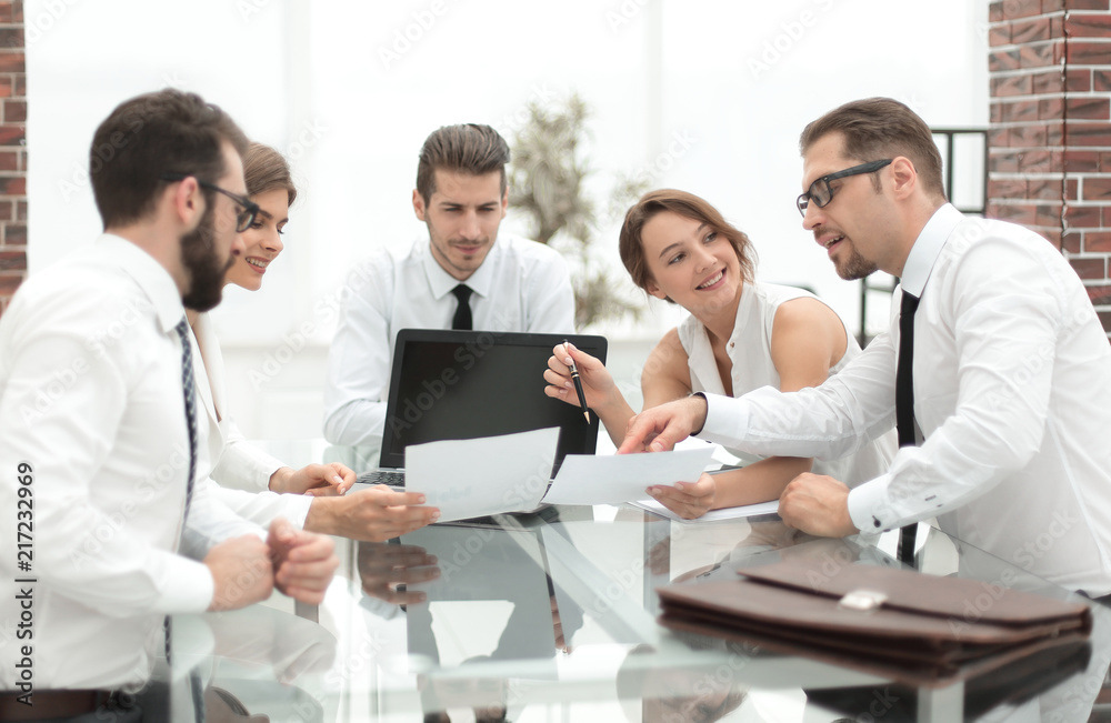 business team discussing financial documents. business team discussing financial documents.