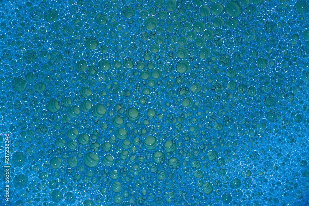 Obraz premium background. defocusing. soap foam is filled with green and blue light
