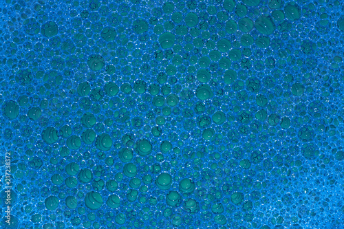 background. defocusing. soap foam is filled with green and blue light