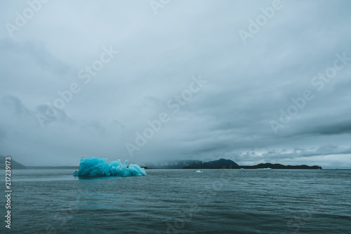 Lone iceberg in dark water