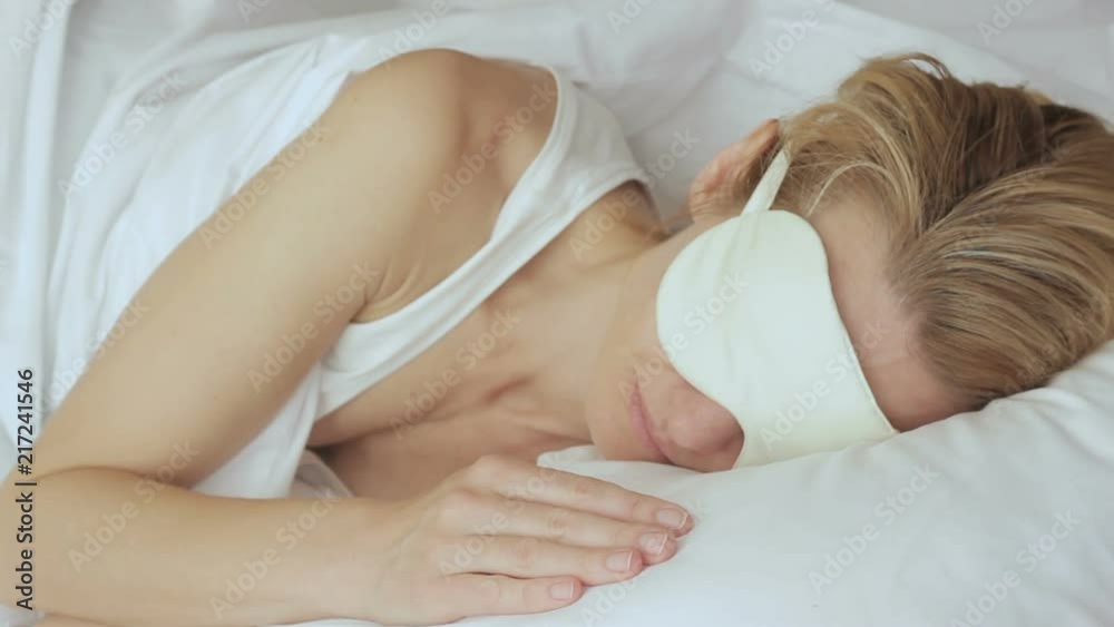 Woman sleeping quietly before going to work, wearing blindfold, having bad sleep Woman sleeping quietly before going to work, wearing blindfold, having bad sleep