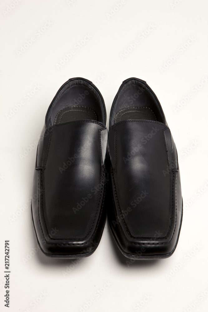 black leather shoes on the white background. black leather shoes on the white background.