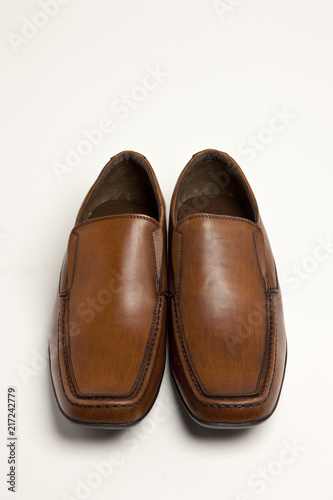 brown leather shoes on the white background.