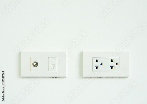 Electrical outlet in Thailand, double power socket and tv or radio socket on the wall.