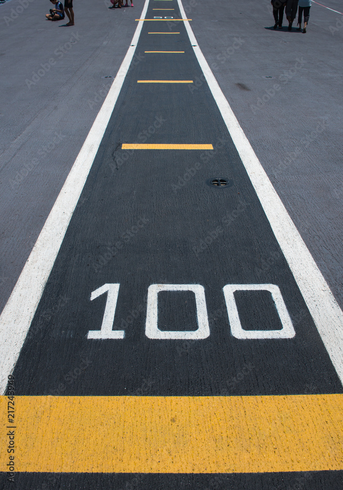One hundred meters, runway on an aircraft carrier(abstract meaning apply for one hundred).Number