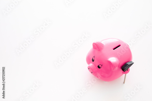 Piggy bank. Moneybox in shape of pig near hammer on white background copy space