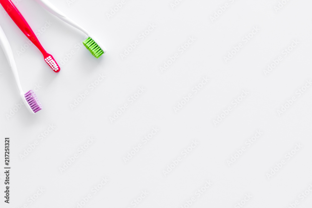 Clean teeth. Toothbrushes on white background top view copy space Clean teeth. Toothbrushes on white background top view copy space