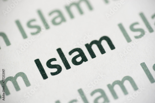 word Islam printed on paper macro photo