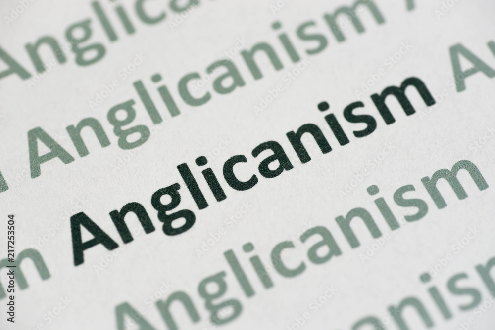 word Anglicanism printed on paper macro word Anglicanism printed on paper macro