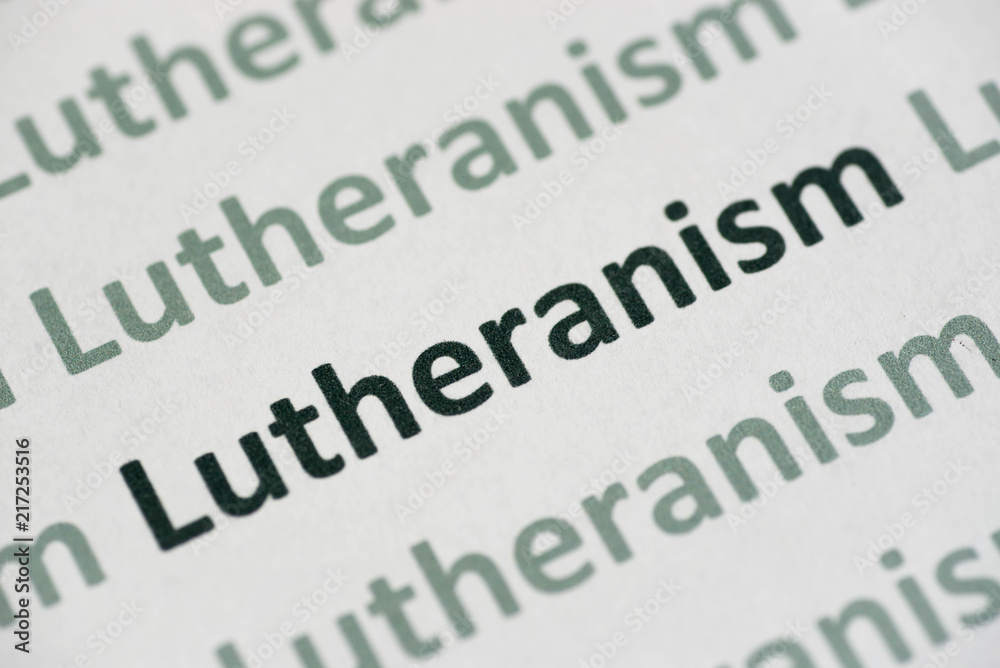word Lutheranism printed on paper macro word Lutheranism printed on paper macro
