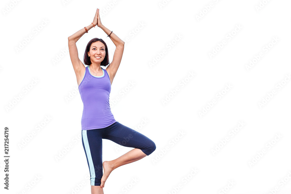 Woman doing yoga standing asana isolated on white Woman doing yoga standing asana isolated on white