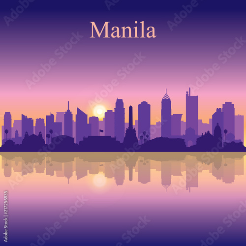 Manila city silhouette on sunset background