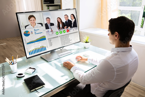 Businessman videoconferencing on computer photo