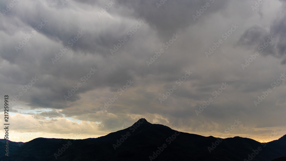 Dark cloudscape landscape mountain peak silhouette