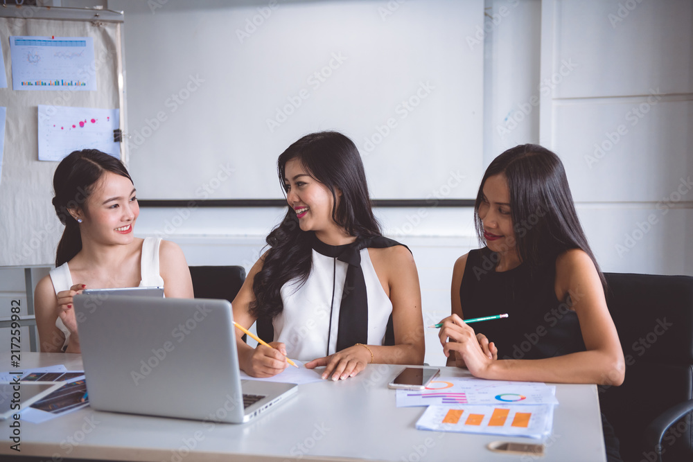Young businesswomen brainstorming in office. Young businesswomen brainstorming in office.
