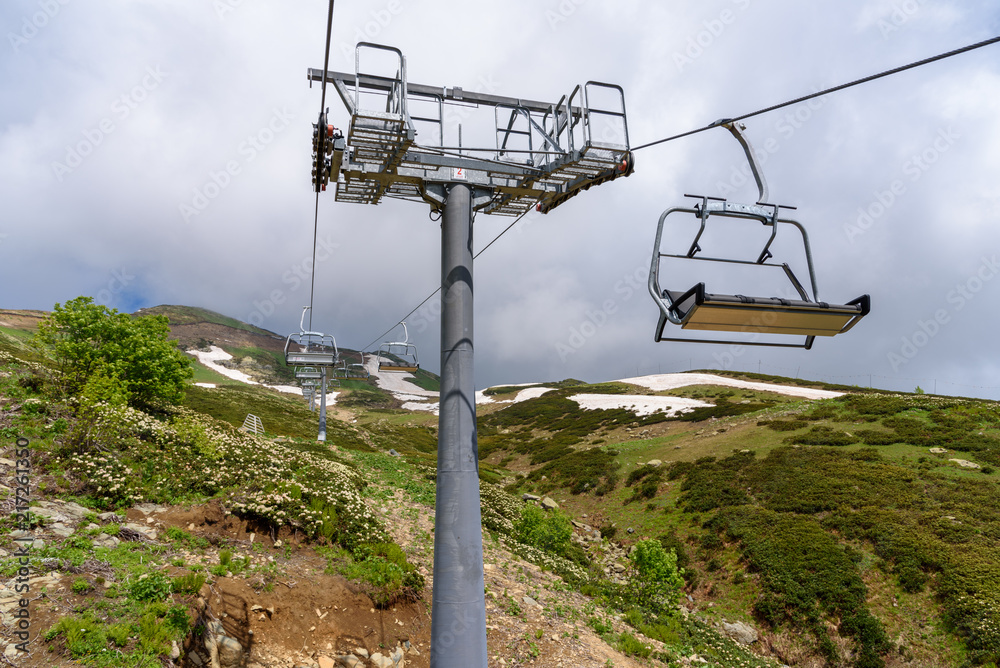 Ski lifts leading to the top of the mountain. The Caucasus. Krasnaya Polyana, Sochi, Krasnodar Krai, Russia. 