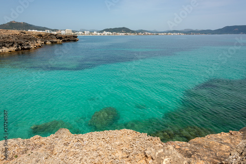 View over the clear turquoise waters of the Mediterranean to the beach of Cala Millor on the Spanish Mediterranean island Mallocra
