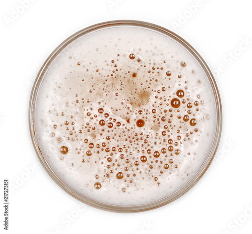 Glass of beer with bubble isolated on white, top view