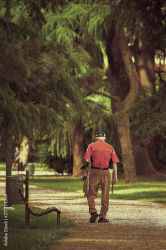 abandoned senior walking, lonely grandfather at the park
