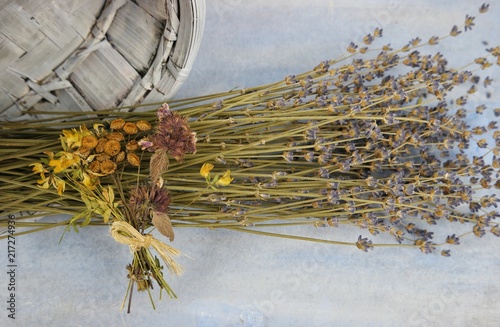 Fototapeta Naklejka Na Ścianę i Meble -  The bouquet of dry lavender on the pale blue background, floral arrangement