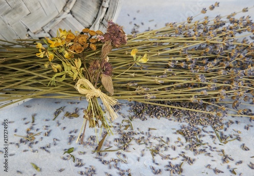 Fototapeta Naklejka Na Ścianę i Meble -  The bouquet of dry lavender on the pale blue background, floral arrangement