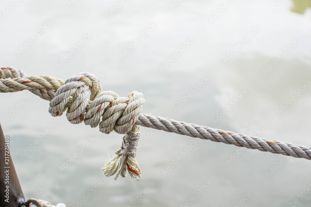 The rope knot's on the beach.