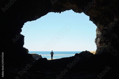 Opening to the sea from the inside of a large cave on the seashore, Cova Tallada, Mediterranean, Costa Blanca, Javea, Alicante, Valencia, Spain photo