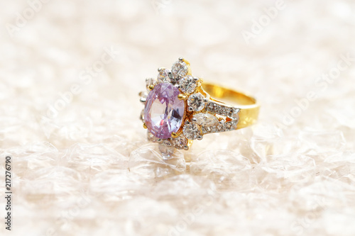 pink gemstone on diamond ring