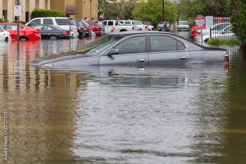 Cars submerged  in Houston, Texas, US during hurricane Harvey. Water could enter the engine, transmission parts or other places. Disaster Motor Vehicle Insurance Claim Themed. Severe weather concept