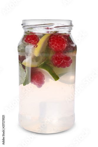 Glass jar of fresh raspberry mojito on white background