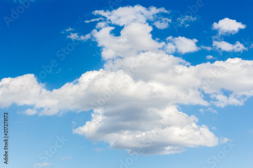 Blue sky with white clouds background © sgolovunin