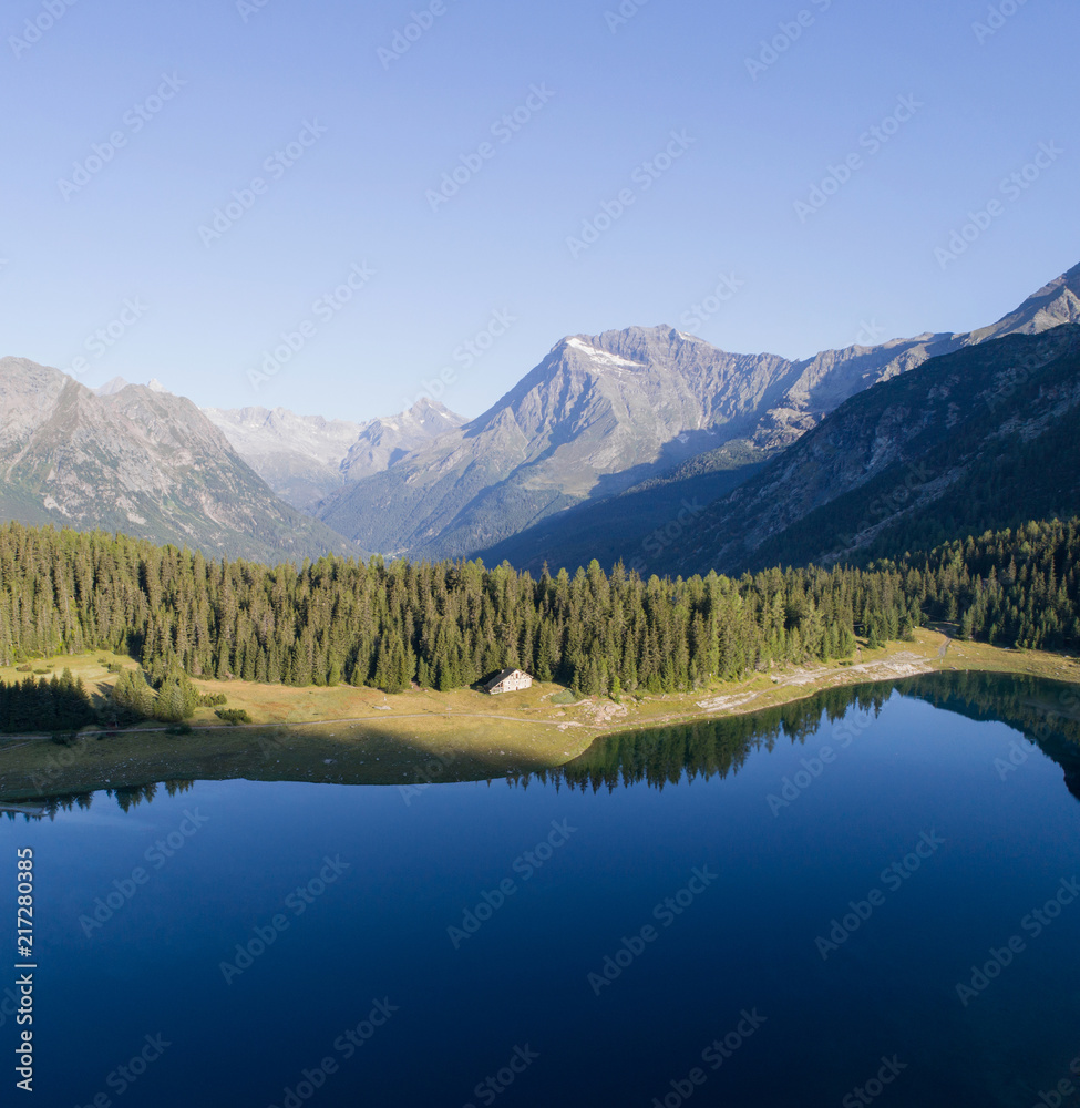 Alpine lake in Valtellina. Palù lake in Valmalenco. Aerial photo