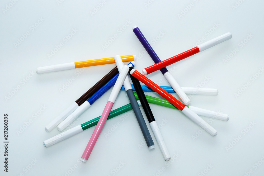 Multi-colored children's felt-tip pens on a white background