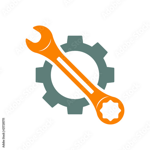 Icono plano engranaje con llave en diagonal en gris y naranja