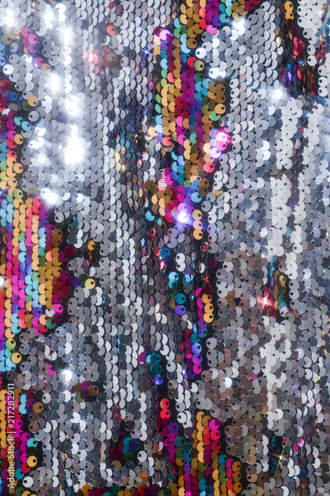 sequins colorful on the fabric. Texture scales of round sequins sequins colorful on the fabric. Texture scales of round sequins