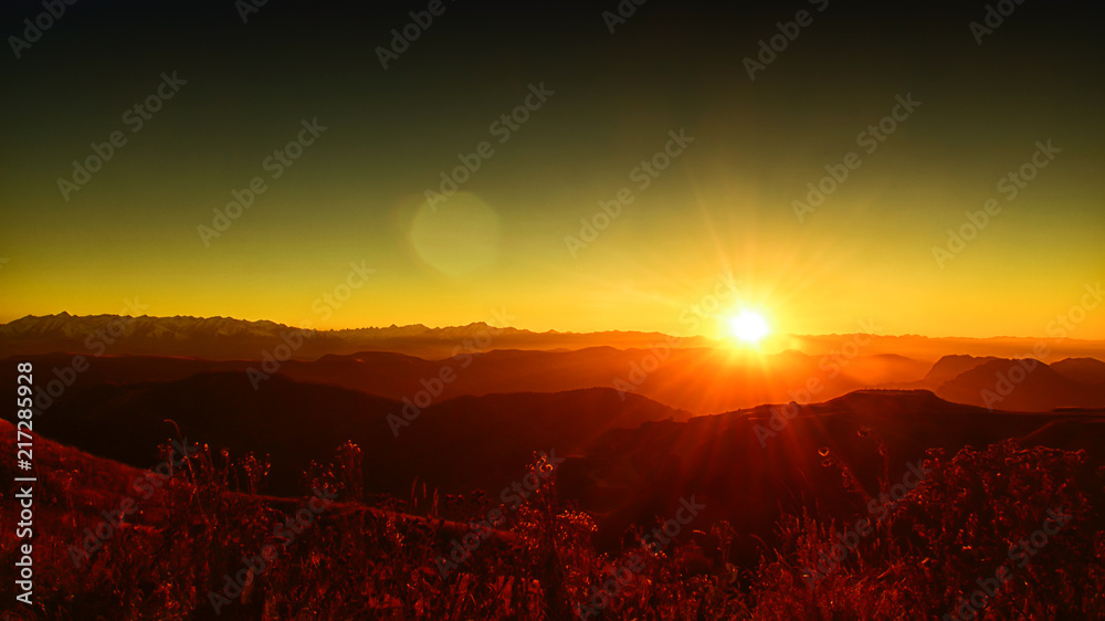 sunset in the mountains, backlight, the sun hides behind the mountains, an observation deck, the rays of the sun, the end of the day