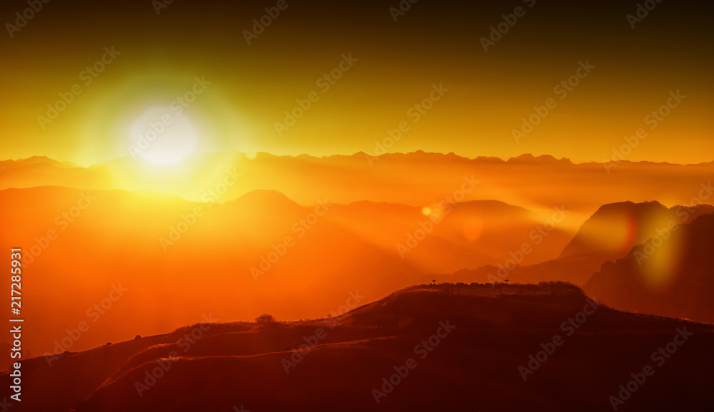 sunset in the mountains, backlight, the sun hides behind the mountains, an observation deck, the rays of the sun, the end of the day sunset in the mountains, backlight, the sun hides behind the mountains, an observation deck, the rays of the sun, the end of the day