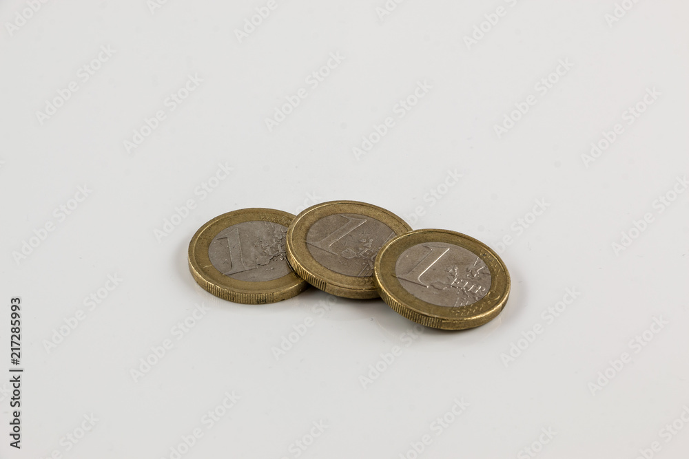 Euro coins on white background with reflections Euro coins on white background with reflections