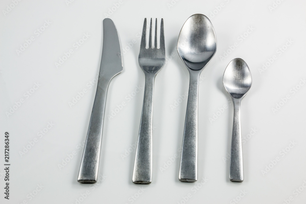 Cutlery with knife, fork, table spoon and little spoon Cutlery with knife, fork, table spoon and little spoon