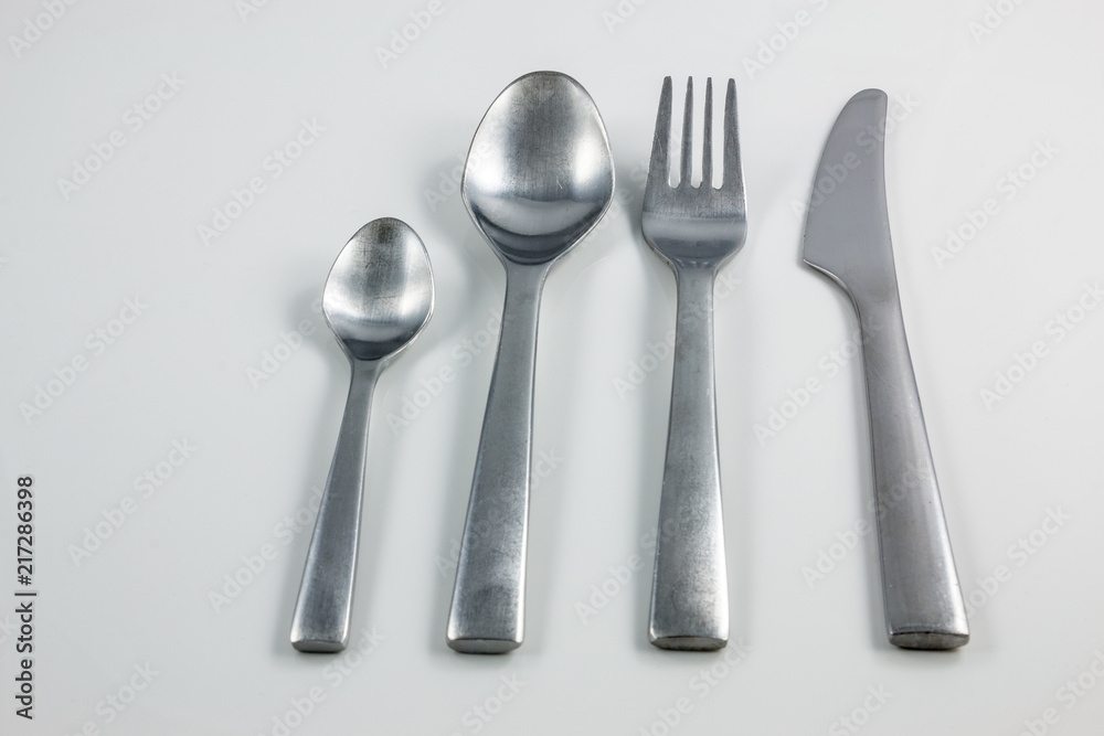 Cutlery with knife, fork, table spoon and little spoon Cutlery with knife, fork, table spoon and little spoon