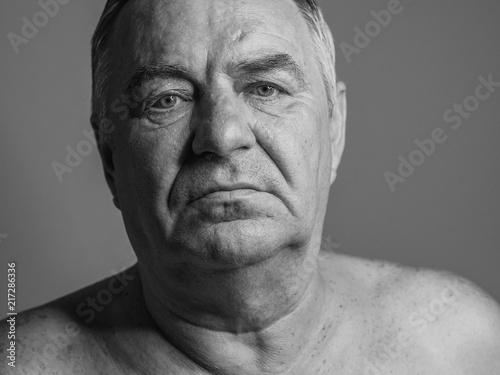 Black and white portrait of aged man.