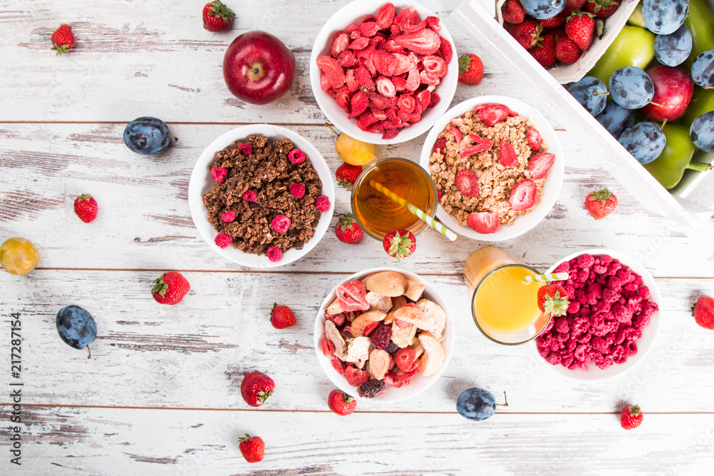 Breakfast served with healthy cereals, orange and apple juice, fruits