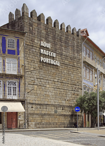 Text 'Portugal was born here' on the wall in Guimaraes