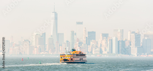 Staten Island Ferry and Lower Manhattan Skyline, New York City, USA.