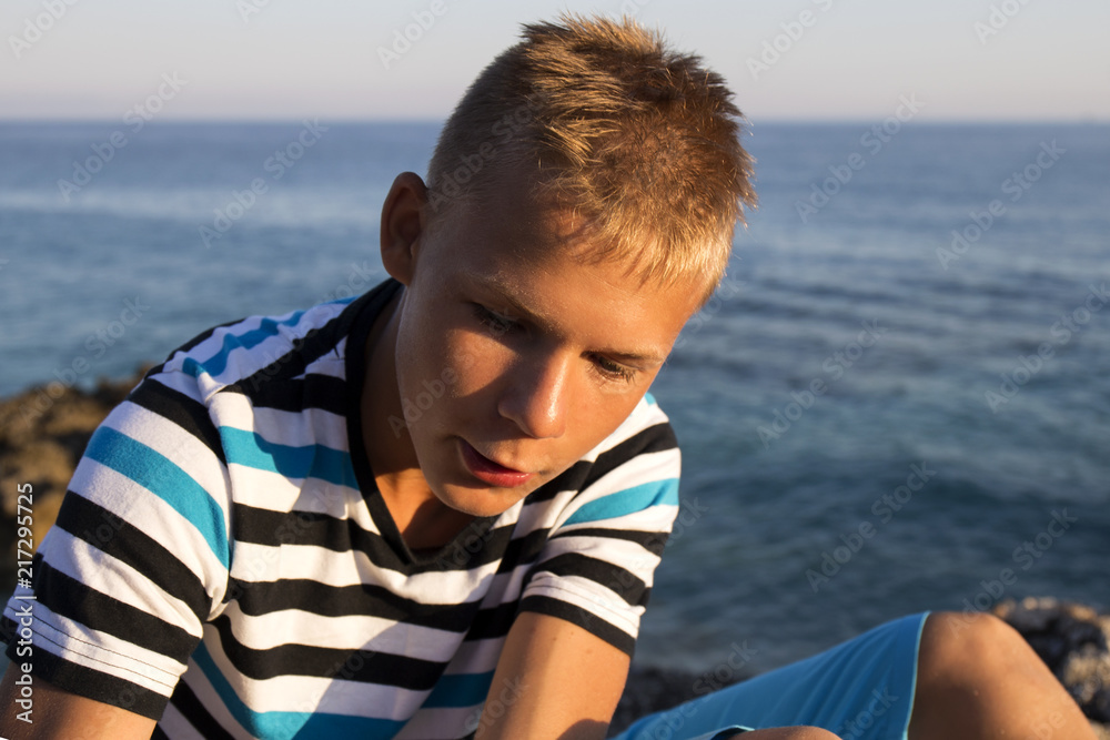 Closeup portrait of a cute happy teenager on a tropical beach Closeup portrait of a cute happy teenager on a tropical beach