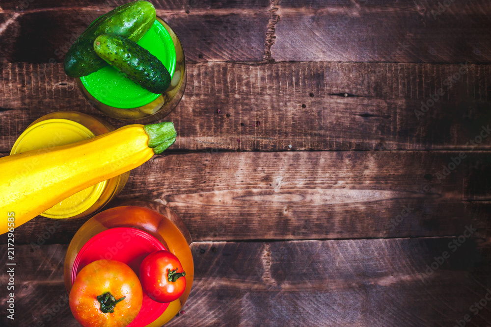 Jars of pickes on a wooden background. Stock of food. Autumn concept. Top view. Copy space