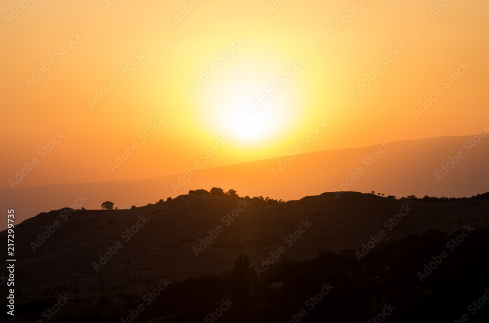 Fototapeta premium Yellow sun and mountains