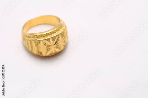 Beautiful gold ring on white background