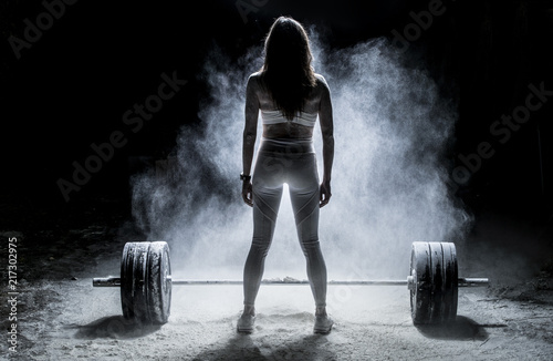 Woman working out with weig...