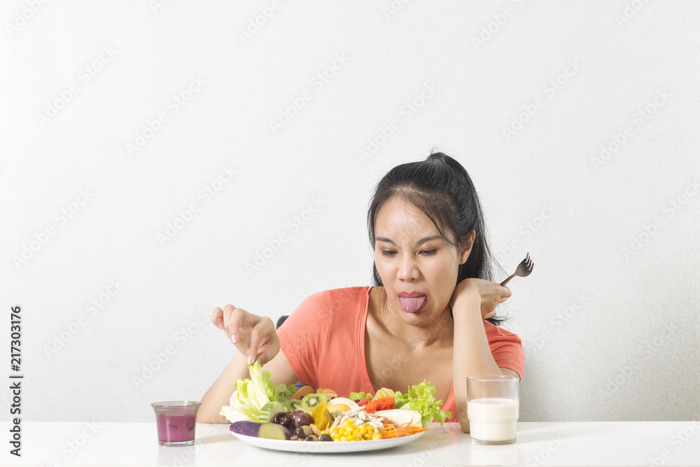Woman does not like vegetable. Unhappy woman does not like healthy food, Emotional face. Woman does not like vegetable. Unhappy woman does not like healthy food, Emotional face.